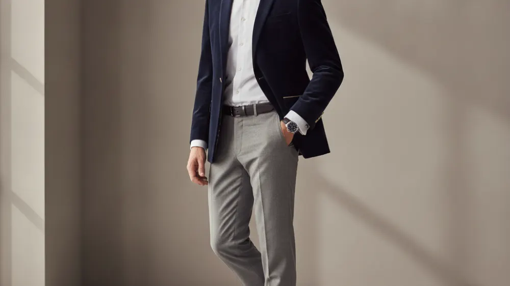 brown blazer, white French cuff shirt, dark twill trousers, suede loafers
