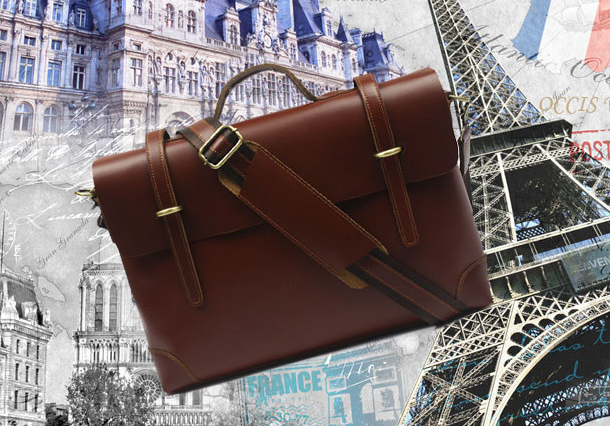 Brown vintage messenger bag rear panel and strap mount