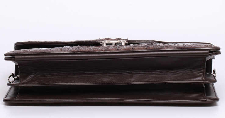 Brown crocodile briefcase three-quarter view showing gusset depth