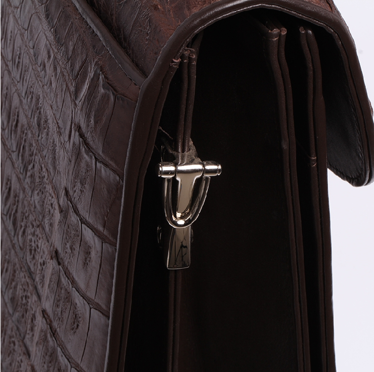Brown crocodile briefcase scale alignment across the centre seam