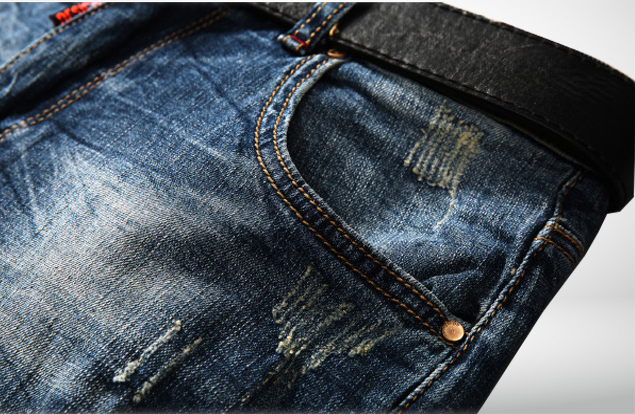 Close detail of the floral trim on stonewashed denim